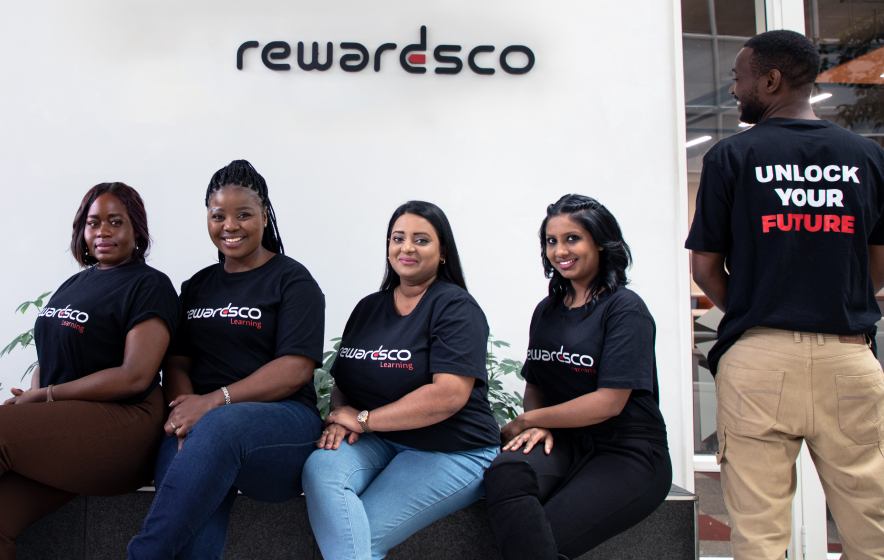 Rewardsco Learning team members in branded tees